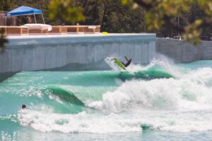 Surfer catches waves at WACO wave pool in Texas