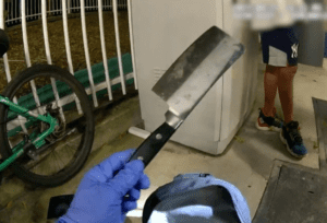 Police taking knife off suspect