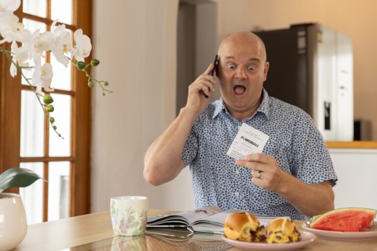 Man eating breakfast with ticket