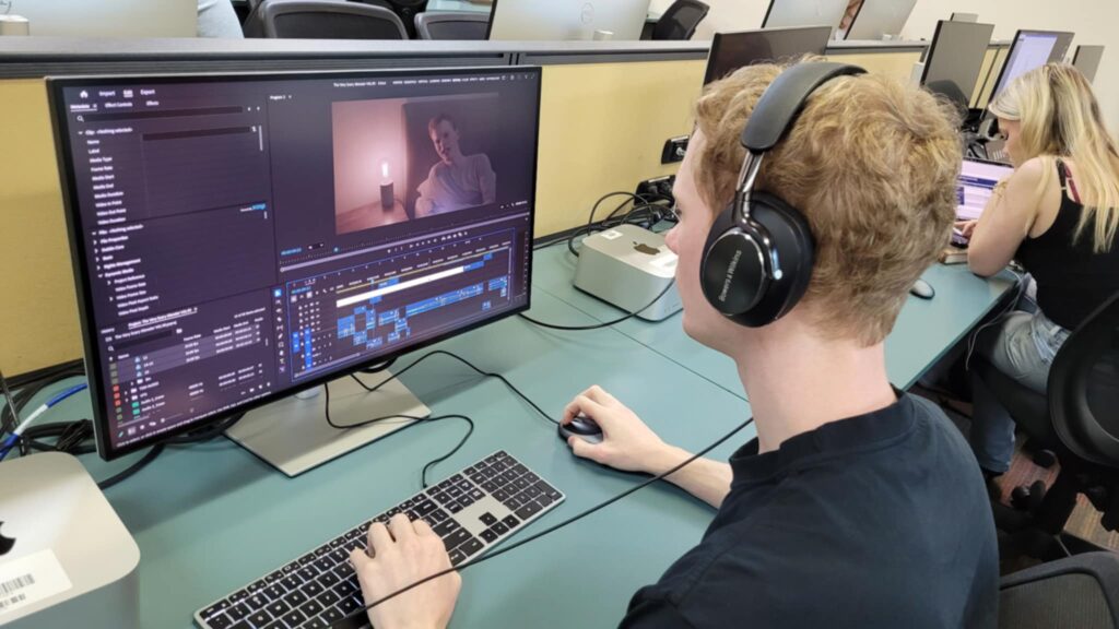 Brodie McNaughton editing in TAFE classroom