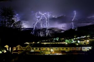 https://www.pexels.com/photo/lightnings-over-town-at-night-20783514/