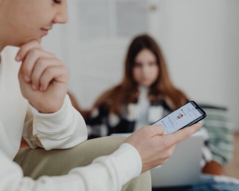 Photo by https://kaboompics.com/: https://www.pexels.com/photo/hands-of-a-boy-using-a-smart-phone-6255940/