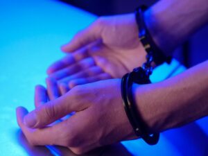 https://www.pexels.com/photo/person-wearing-metal-handcuffs-7773261/