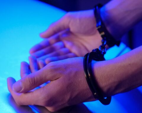 https://www.pexels.com/photo/person-wearing-metal-handcuffs-7773261/
