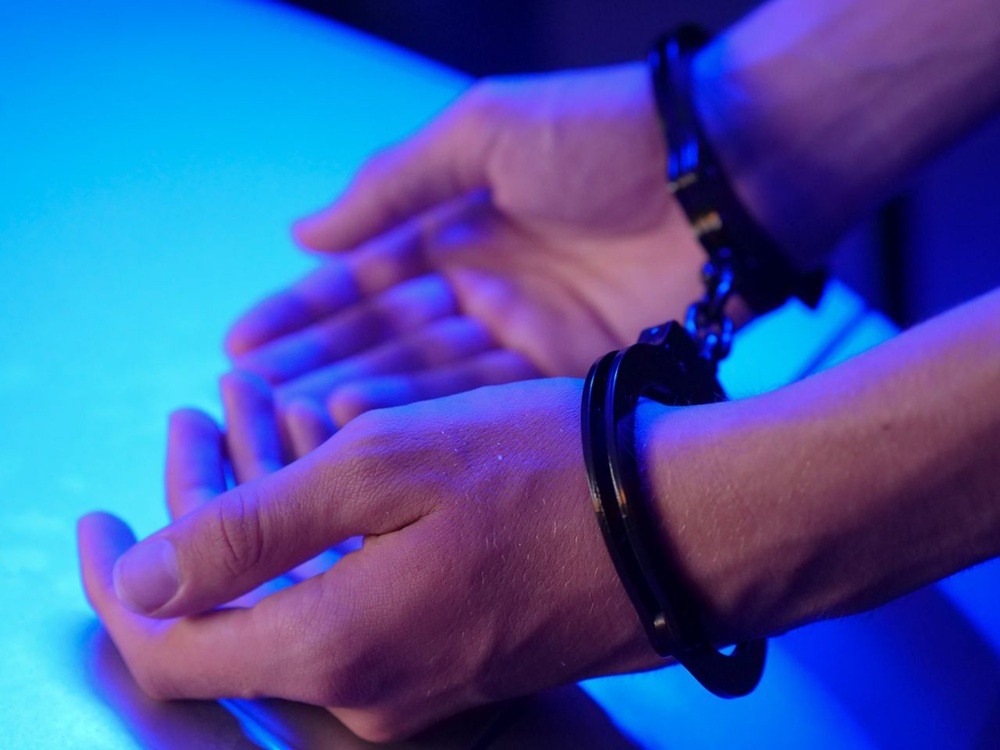 https://www.pexels.com/photo/person-wearing-metal-handcuffs-7773261/